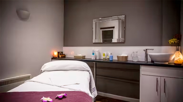 A tranquil spa treatment room offering soothing therapies at The Cheltenham Spa.
