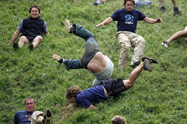 Mad-cap competitors plunge downhill in chaotic, high-speed countryside spectacle