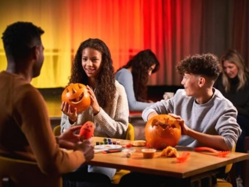 Children carving pumpkins during an October Half Term break at Whitemead Forest Park