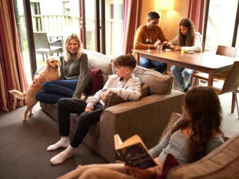 Family enjoying an autumn break in a Premier Apartment at Whitemead Forest Park